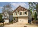 Two-story home with shutters, a two-car garage, and a neatly maintained lawn and landscaping at 540 Broughton Dr, Canton, GA 30114