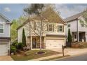 Charming two-story home with neat landscaping, shutters and a two-car garage at 540 Broughton Dr, Canton, GA 30114