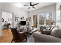 Inviting living room featuring bright windows and hardwood flooring adjacent to a bedroom and balcony at 201 W Ponce De Leon Ave # 303, Decatur, GA 30030
