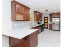 Modern kitchen with custom cabinets, white countertops, and stainless steel appliances at 2010 Bixby Se St, Atlanta, GA 30317