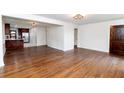 Spacious living room featuring hardwood floors and an open layout to the kitchen at 2010 Bixby Se St, Atlanta, GA 30317