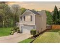 View of the side of this home with a manicured lawn and inviting curb appeal at 3835 New Salem Ct, Cumming, GA 30040