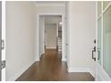Inviting foyer featuring hardwood floors and a view of the staircase at 685 Summitt Hill Way, Cumming, GA 30040
