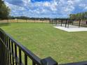 Spacious fenced backyard, offering secure outdoor space and serene green views for relaxation and play at 1000 Sutherland Lane (Lot 35), Lawrenceville, GA 30043
