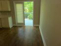 The kitchen features access to the deck, and has laminate flooring and neutral colored walls at 1234 Pinedale Nw Cir, Conyers, GA 30012
