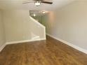 Bright living room with laminate flooring and neutral paint, creating a cozy and inviting space at 1234 Pinedale Nw Cir, Conyers, GA 30012