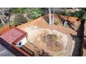 Overhead view revealing a spacious backyard with wooden fence, play set, and landscaping at 1721 Hudson Woods Trl, Decatur, GA 30033