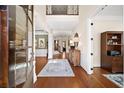 Elegant foyer featuring gleaming hardwood floors, high ceilings, and a view of the staircase at 2358 New Salem Trce, Marietta, GA 30064