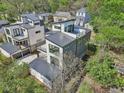 Aerial view of a modern home showcasing its roof deck, sleek design, and a detached garage at , Atlanta, GA 30310