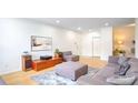 Cozy living room with sleek furniture, hardwood floors, and a calming neutral palette at 200 Renaissance Ne Pkwy # 219, Atlanta, GA 30308