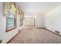 Spacious living room featuring large windows and vintage design elements at 1048 Tumblewood Trl, Lawrenceville, GA 30044