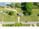 Aerial view of property with a white home and a long driveway with trees at 12042 Brown Bridge Rd, Covington, GA 30016