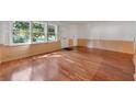 Inviting living area with lustrous hardwood flooring and large windows, bringing in plenty of natural light at 270 Lakemoore Dr # B, Atlanta, GA 30342