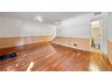 Spacious living room with beautiful hardwood floors, stairway, and a convenient half-bathroom at 270 Lakemoore Dr # B, Atlanta, GA 30342