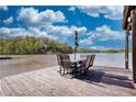 Dockside outdoor dining with lake view, perfect for relaxing and enjoying the waterfront lifestyle at 480 Friar Tuck Cir, Covington, GA 30014