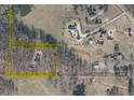 Expansive aerial view showing the property boundary and surrounding wooded landscape at 527 Gaddis Rd, Canton, GA 30115