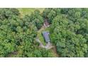 Aerial perspective of a home nestled among thick trees, highlighting its secluded location at 527 Gaddis Rd, Canton, GA 30115