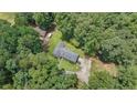 Aerial view of a home surrounded by lush trees, showcasing the peaceful and private setting at 527 Gaddis Rd, Canton, GA 30115