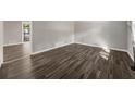 Bright and airy living room showcases modern wood-look flooring and neutral gray walls at 1971 Westley Dr, Riverdale, GA 30296