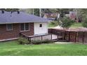View of the home's wooden deck and fenced yard that create a private outdoor space at 223 Lucerne St, Decatur, GA 30030