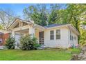 Cozy bungalow with manicured lawn, showcasing the home's inviting curb appeal at 946 Crew Sw St, Atlanta, GA 30315