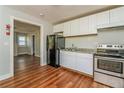 Functional kitchen with stainless steel oven and a black refrigerator at 946 Crew Sw St, Atlanta, GA 30315