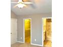 Neutral bedroom offers an ensuite bathroom with shower and walk-in closet at 1975 Hoods Fort Nw Cir # 24, Kennesaw, GA 30144