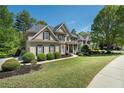 Well-manicured lawn and a charming front porch enhance this home's curb appeal at 629 Gold Valley Pass, Canton, GA 30114
