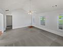 Spacious living room with vaulted ceilings, neutral paint, and lots of natural light at 823 New Hope Rd, Mcdonough, GA 30252