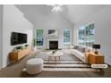 Bright living room with a fireplace, and large windows at 131 Diamond Ct, Carrollton, GA 30116