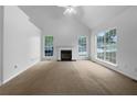 Living room featuring large windows and a fireplace at 131 Diamond Ct, Carrollton, GA 30116