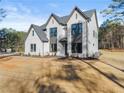 Beautiful two story white brick home with large windows and well kept front yard at 3735 Tamiami Trl, Cumming, GA 30041