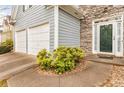 Home featuring a two-car garage, and inviting entrance with a stone facade at 4034 Brockett Walk, Tucker, GA 30084
