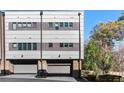 Contemporary townhome showcasing integrated garage doors and sleek architectural details at 611 King Arnold St, Atlanta, GA 30354