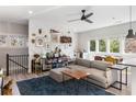Inviting living room filled with natural light, accented by a comfy couch, stylish decor and hardwood flooring at 611 King Arnold St, Atlanta, GA 30354