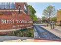 Exterior view of Mill Town Lofts community sign with gated entrance on Wylie Street at 791 Wylie Se St # 102, Atlanta, GA 30312