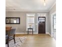 Inviting foyer with hardwood floors and a charming front door at 4105 Woodwind Dr, Cumming, GA 30028