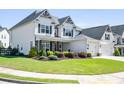 Charming home with well-kept lawn, lush landscaping, and a welcoming facade at 4105 Woodwind Dr, Cumming, GA 30028