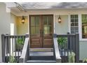Close-up of the beautiful double front doors with sidelight windows and decorative lanterns at 1819 Yorkshire Dr, Woodstock, GA 30189