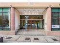 Peachtree Towers features a secure entry with glass doors and prominent signage at 300 Peachtree Ne St # 21H, Atlanta, GA 30308