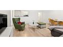 Bright living room features wood floors and lots of space for entertaining guests at 300 Peachtree Ne St # 21H, Atlanta, GA 30308