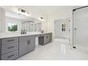 Bright bathroom with dual sinks, sleek cabinetry, and walk-in shower at 3915 Clifton Hill Court #1, Cumming, GA 30040