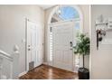 Bright entryway with wood floors, a large window above the door, and decorative accents at 3076 Nectar Dr, Powder Springs, GA 30127