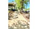 Long driveway leading to a charming home with ample parking space at 635 Sw Queen Sw St, Atlanta, GA 30310