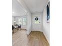 Inviting entryway with wood floors and view into the office space at 734 Great Oak Pl, Villa Rica, GA 30180