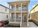 Stylish two-story home with a double stacked front porch, perfect for enjoying the outdoors at 106 Hogue St, Atlanta, GA 30312