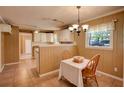Eat-in kitchen boasts white cabinets, tile flooring, and a cozy breakfast nook at 1336 Shirley Dr, Sugar Hill, GA 30518