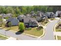 Suburban neighborhood featuring well-maintained homes, green lawns, and tree-lined streets at 147 Johnston Farm Ln, Woodstock, GA 30188