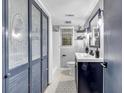 Modern bathroom with stylish vanity, decorative mirror, and tiled shower at 2921 Country Squire Ln, Decatur, GA 30033