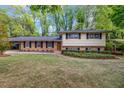 Charming two-story home with landscaped yard at 2921 Country Squire Ln, Decatur, GA 30033
